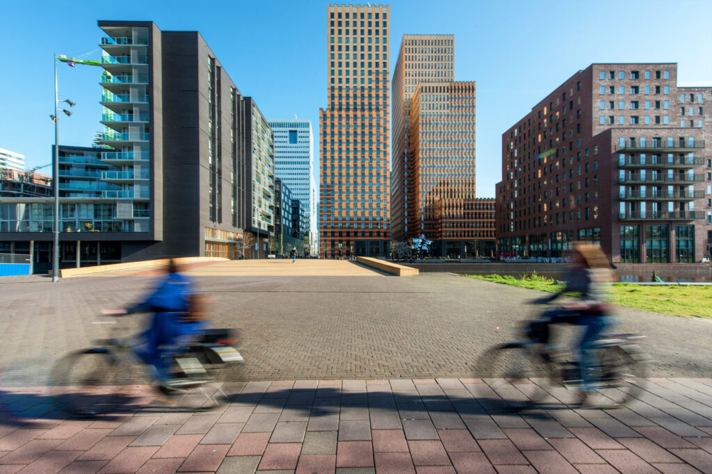 kantoren. Office,Buildings,With,People,Bicycling,At,Amsterdam,Zuid,,Amsterdam,,Netherlands.